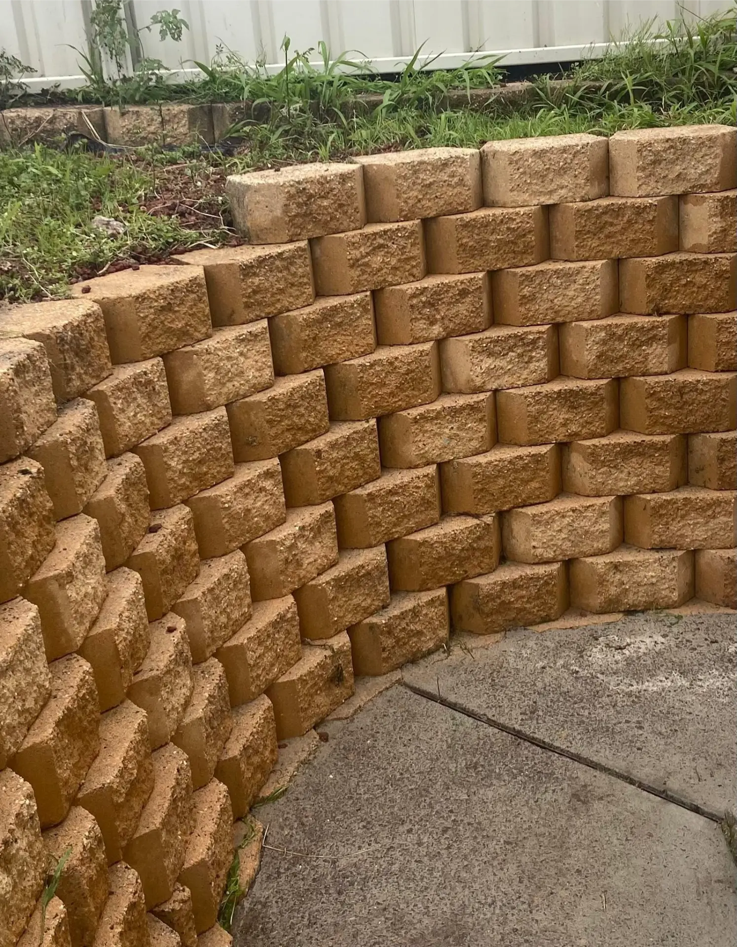 The same concrete surface after pressure washing, clean and even in colour